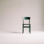 wooden chair on a white wall studio